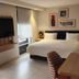 Hampton by Hilton Saltillo guest room with king bed, wall-mounted TV and desk in Saltillo