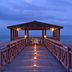Pestana São Tomé pier pavilion over the ocean at dusk, São Tomé