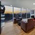 La Quinta by Wyndham Puebla Palmas Angelopolis lounge with city sunset views in Puebla City