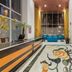 La Quinta by Wyndham Puebla Palmas Angelopolis lobby with floral tile floor and seating in Puebla City