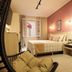 Hotel Itamarati Centro-República room in Sao Paulo with bed, window nook and hanging chair