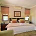 Bellgrove Guest House Sandton bedroom in Johannesburg with double bed, bedside tables and dresser