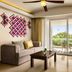 Fiesta Americana Riviera Nayarit suite with sofa, balcony, and ocean-view greenery in Nuevo Vallarta