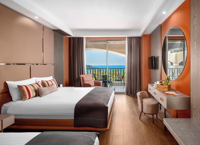 Kirman Arycanda De Luxe in Okurcalar guest room with balcony sea view and twin beds