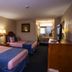 Downtowner Inn and Suites Houston room with two double beds and a vanity area