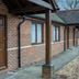 The Carrington Arms, Newport Pagnell: brick hotel exterior with covered walkway and guest room doors