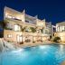 Seascape Hotel in Providenciales with a lit outdoor pool and modern courtyard at night