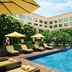 JW Marriott Hotel New Delhi Aerocity outdoor pool with lounge chairs and umbrellas in New Delhi