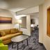 Fairfield Inn & Suites by Marriott Sierra Vista guest suite with sofa, table, desk and wall-mounted TV