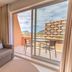 Vila Baleira Porto Santo room with sofa, balcony seating, and mountain view in Porto Santo