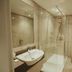 Dunadry Hotel And Gardens, Antrim bathroom with glass walk-in shower, sink and toilet
