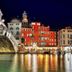 Ca Rialto House in Venice by the Rialto Bridge and canal reflections at night