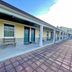 Red Carpet Inn & Suites Morgantown exterior corridor with covered walkway and room entrances
