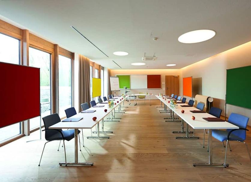 Hotel Bora Hotsparesort Radolfzell conference room with U-shaped tables and large windows