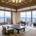 Hotel Biwanso in Nanao ocean-view tatami room with seating and sliding glass doors