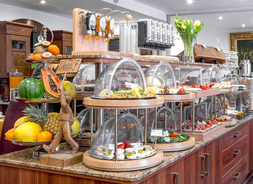 Tiptop Hotel Burgschmiet Garni Nuremberg breakfast buffet with fruit, pastries and hot dishes