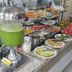 Faixa Hotel breakfast buffet with juice dispensers, pastries, fruit, yogurt and cold cuts in Vitória da Conquista