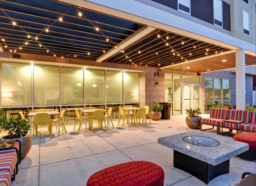 Home2 Suites by Hilton Tampa - USF/Near Busch Gardens patio with string lights, seating and fire pit