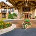 Eagleridge Lodge & Townhomes in Steamboat Springs entrance with stone facade and flower-lined driveway