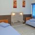Hotel Blue Star II in Foz do Iguaçu guest room with two single beds and blue window blinds