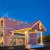Super 8 by Wyndham Ashland/Richmond exterior at dusk with lit entrance and staircase in Ashland