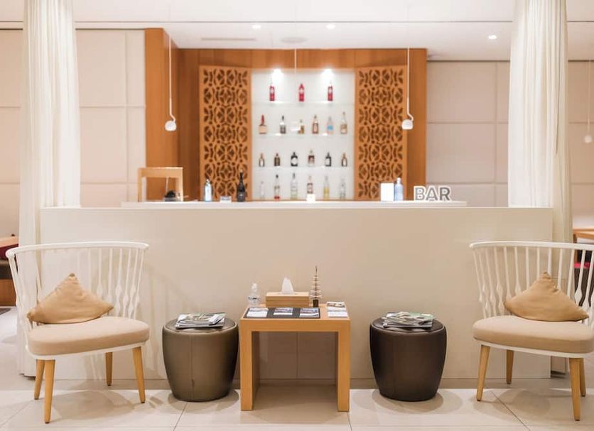 The Passage - Urban & Lifestyle Hotel Basel lobby bar with lounge chairs and bar counter