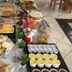 Hotel Arco Do Sol buffet table with breads, pastries, cheese, cold cuts, yogurt and juice in Balneário Camboriú