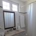 Monte Dos Apóstolos bathroom in Portalegre with marble sink, mirror, window, towel rack and shower curtain