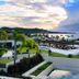Silversands Grand Anse in St. George's with ocean-view terrace, palm trees, and sunset sky