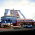 High Point Surabaya hotel exterior with a curved glass facade and tall modern tower in Surabaya