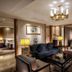 Wuzhou Guest House Shenzhen luxury suite living room with seating area and chandelier