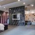 Ohya Chain Boutique Motel Taoyuan room with bed, wall-mounted TV, and lounge seating in Taoyuan City