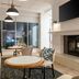Hilton Garden Inn Auburn Lewiston Riverwatch lounge with fireplace, seating and large windows in Auburn