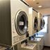 Chisun Hotel Koriyama laundry room with row of coin-operated washers and dryers in Kōriyama