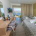 Paradise Lost Hotel-Apartments in Tolo, room with twin beds, balcony sea view and swan towel art