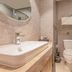 Home Inn Suzhou Mudu Ancient Town Lingyanshan Metro Station bathroom with sink, toilet and glass shower in Suzhou
