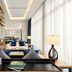 Oakwood Residence Saigon lounge in Ho Chi Minh City with tall windows, seating, and a floor lamp