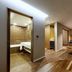 Amanti Hotel Seoul Hongdae room with wood floors, bed, TV and bathroom in Seoul