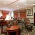 Residence Inn by Marriott Oklahoma City South lounge with sofas, TV, lamp and patterned carpet