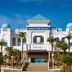 Concorde Green Park Palace in Port El-Kantaoui, grand white hotel entrance with domed towers and palm trees