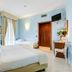 Europa Stabia Hotel guest room in Castellammare di Stabia with two beds, light blue walls and a small desk