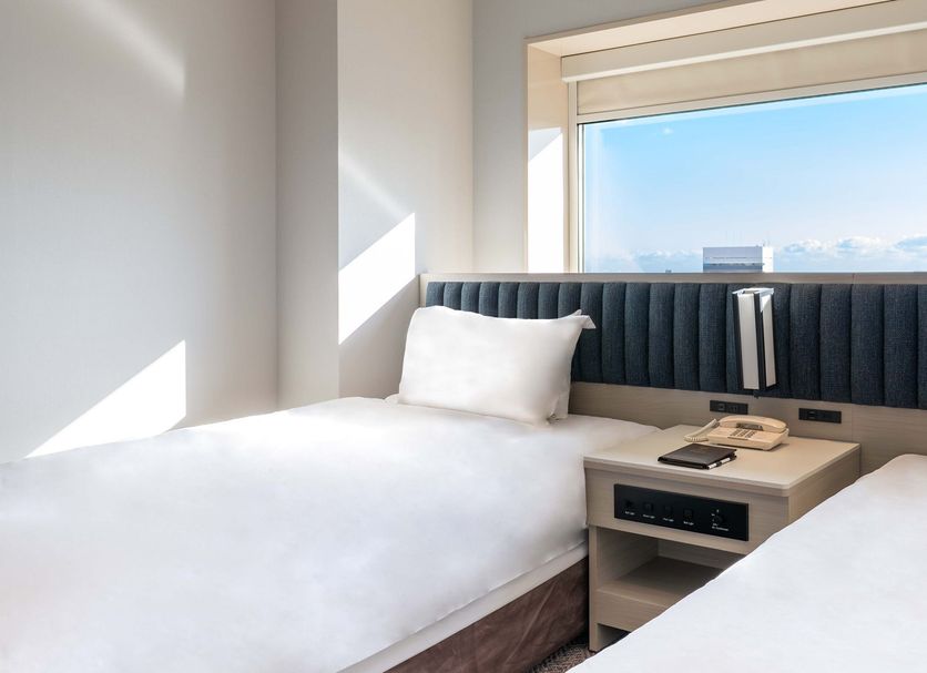 Ana Crowne Plaza Hamamatsu by IHG room with twin beds and window city view in Hamamatsu