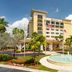 Fort Lauderdale Marriott Coral Springs Hotel & Convention Center in Coral Springs with fountain and palm-lined entrance