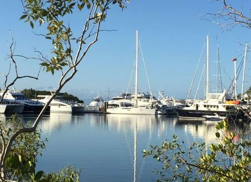 Lazy Lizard Motor Inn in Port Douglas, marina with yachts and calm waterfront view