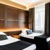 Original Sokos Hotel Vaakuna Joensuu guest room with two single beds and large window in Joensuu