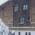 Pension Berggeist in Sölden, snow-covered chalet-style hotel with frosted trees outside