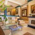 Quinta Maria Cortez Bed & Breakfast in Puerto Vallarta with mosaic walls, loft seating, and arched fireplace