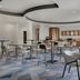 SpringHill Suites by Marriott Jacksonville North I-95 Area breakfast area with tables and chairs in Jacksonville