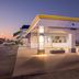 Days Inn by Wyndham Salina South exterior entrance at dusk with covered drive-up canopy