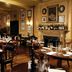 Hotel du Vin Bristol dining room with set tables, fireplace, and wine display in Bristol